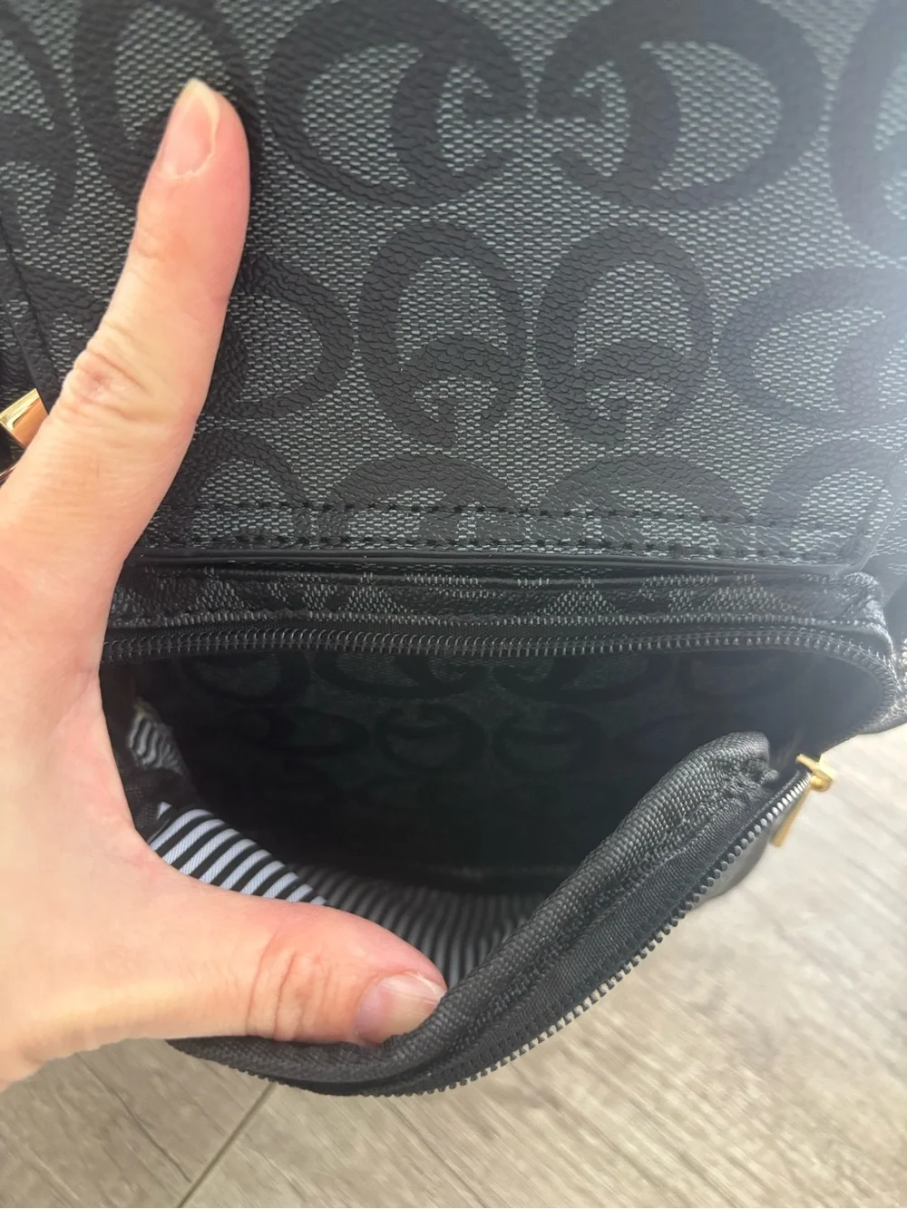 Black Sling Backpack with Signature Pattern